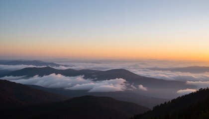 Fototapeta premium Majestic Landscape View of Mountains Covered in Clouds During a Peaceful Sunrise