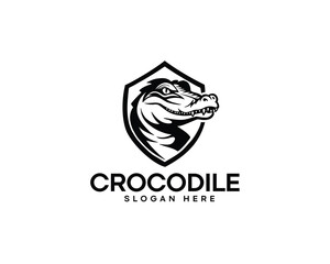 crocodile head silhouette inside shield logo design inspiration