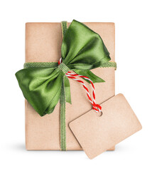 one Christmas box wrapped in brown paper and decorated with a green bow and tag is isolated on a transparent background