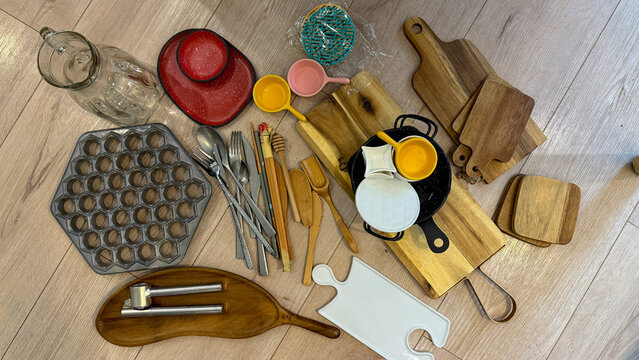 Inviting spread of rustic kitchen tools, whispering tales of culinary witchcraft and Scandinavian Midsummer, wooden elegance in metallic harmony