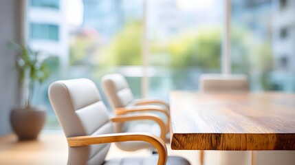 Modern Office Meeting Space with Elegant Wooden Table and Comfortable Chairs Surrounded by Natural Light