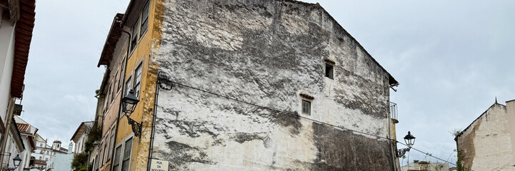 Timeworn facade whispers tales of Fado and saudade, capturing Lisbon's hidden corners under nostalgic autumnal skies