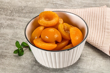Sweet canned apricots with syrope