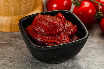 Red tomato paste in the bowl