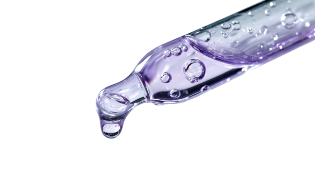 Dropper tip with purple liquid and bubbles, isolated on black