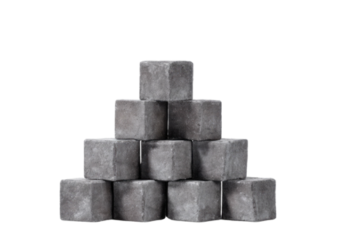 Stone cubes stacked in a pyramid shape on black background