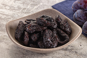 Black dry sweet prunes heap