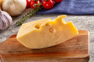 Yellow maasdam cheese triangle piece