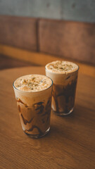 Delicious iced coffee drinks on a wooden table in a cozy cafe setting