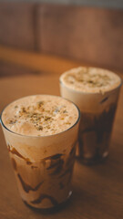 Delicious iced coffee drinks on a wooden table in a cozy cafe setting