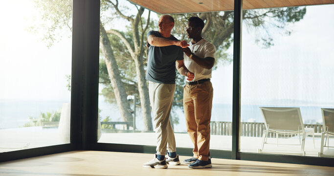 Old man, stretching and therapist for physiotherapy at house with assistance for mobility training. Physiotherapist, helping and senior person of physical recovery, medical support and rehabilitation