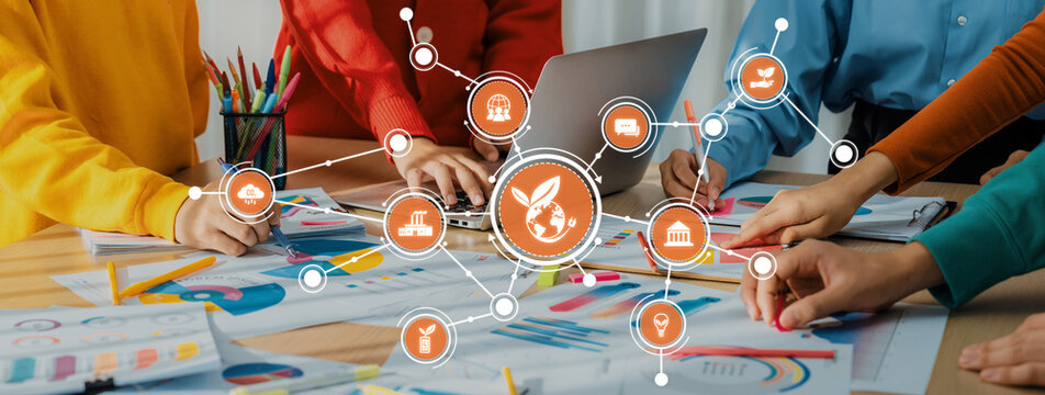 A vibrant collaborative business planning session showcasing teamwork and creativity in a modern workspace with colorful elements and digital technology integration. Amity