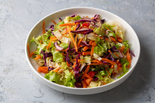 Turkish style lettuce salad. Diet salad with lettuce, red cabbage, tomatoes, and carrots.