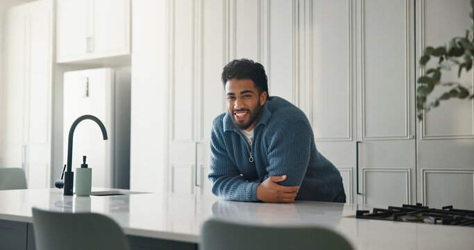 Property, portrait and man in kitchen with pride, fresh start and investment in dream house. Success, real estate and happy male in home with arms crossed, relocation or achievement for new homeowner