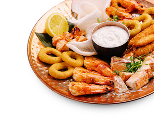 Seafood platter features shrimp, fish, and sides served on copper dish