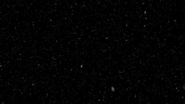 Realistic falling snow effect against a dark night sky, ideal for compositing winter scenes, creating a serene and magical atmosphere with gentle precipitation