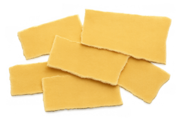Uncooked pappardelle pasta pieces with torn edges on transparent background, top view, traditional italian food preparation