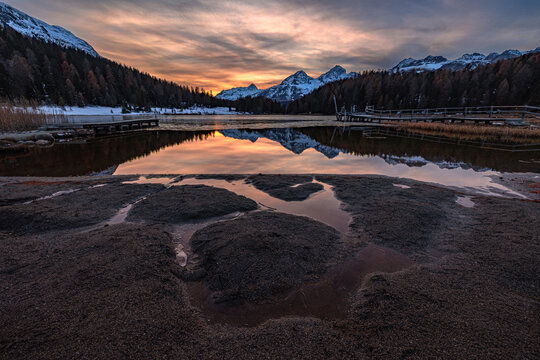 Beautiful sunset sky over the Staz Lake in the famouse St. Moritz of Swiss Alps moountain, Grisons, Swtzerland