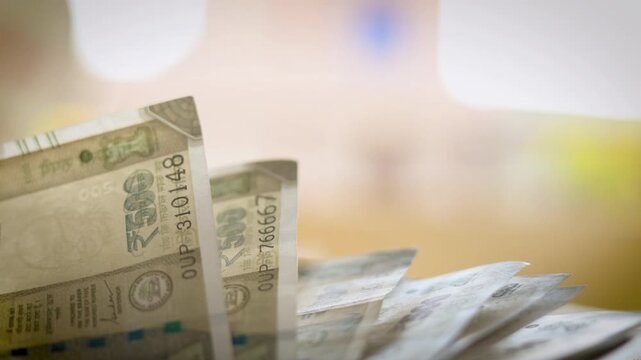 Indian 500 Rupee Banknote Moving in Breeze on Table