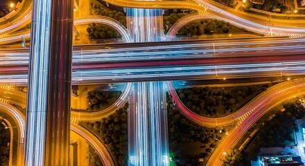 Epic Aerial View of a Busy City Highway Interchange at Night With Streaking Lights