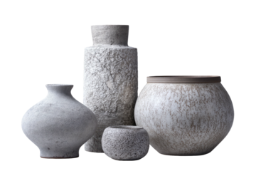 Four textured ceramic vases in varying sizes and neutral colors