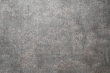 Fototapeta premium Close-up of a gray concrete wall surface with a rough, weathered texture, suitable for use as a background or design element. 