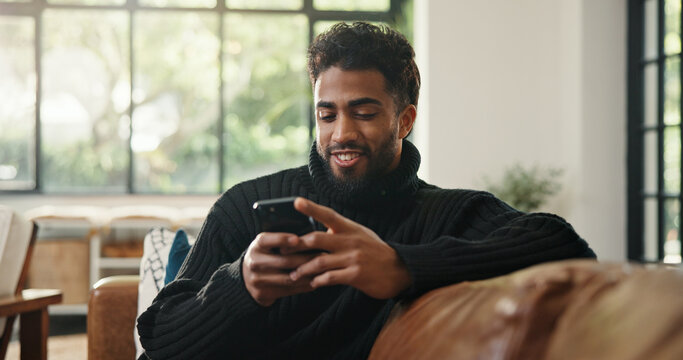 Relax, cellphone and man with smile, internet and social media with communication. Home, smartphone and happy person with email notification, texting and connection with online reading or digital app - Powered by Adobe