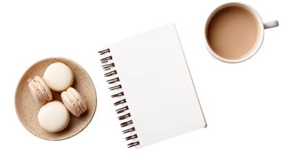 Creamy macarons, notebook, and coffee