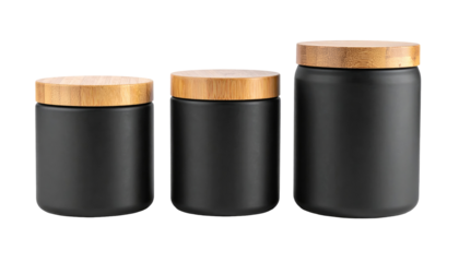 Three sleek, black cylindrical containers of varying sizes with matching light-brown, wooden lids are arranged on a black backdrop