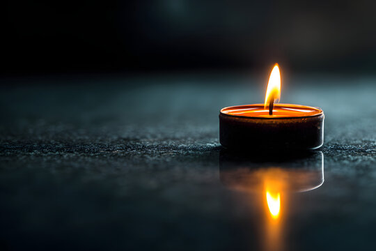 soft glowing candlelight surrounded by warm golden bokeh creating a comforting atmosphere of inner peace