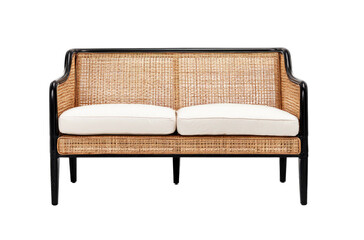 Wicker sofa with dark frame, two white cushions, against black backdrop
