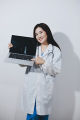 Female druggist standing with a digital tablet