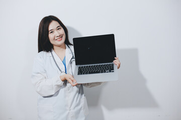 Female druggist standing with a digital tablet