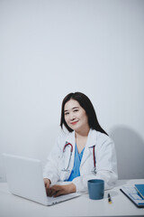 Receptionist working at the hospital registering patients