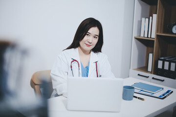 Receptionist working at the hospital registering patients