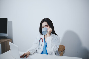 Female scientist holding coffee mug in laboratory