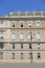 Piazza Unità d'Italia Square with Prefecture Building Facade and Lamp Post in Trieste, Italy