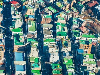 Fototapeta premium Aerial view of colorful buildings and long shadows