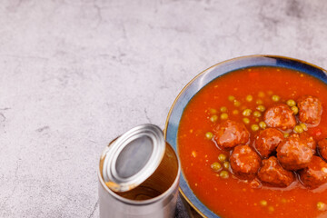 Traditional meatballs with peas in can
