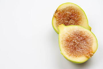 Fresh fig halves showing juicy texture and seeds.