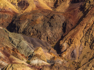 Vivid red rock canyon in Central Asian mountains, displaying nature's powerful artistry