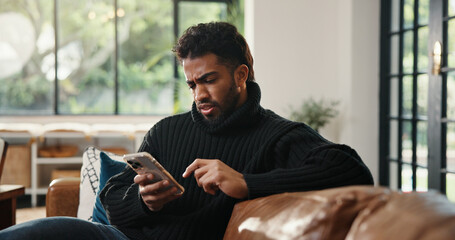 Phone, confused and reading with man on sofa for phishing scam, verification error and glitch....