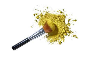 Makeup brush rests on a pile of bright yellow eyeshadow powder