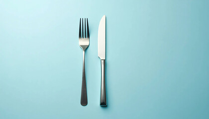 Silver fork and knife on a blue background