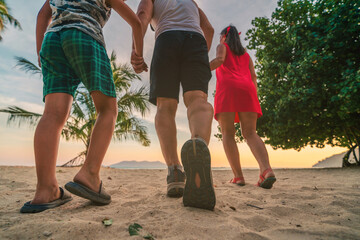 family walking on the beach