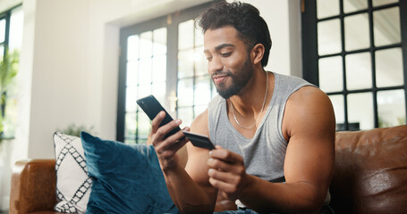 Happy, man or credit card on sofa with phone, payment or Black Friday discount for online shopping....