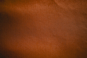brown leather texture with small, even grains. brown leather material background
