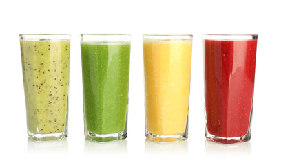 Yummy smoothies of different flavors in glasses isolated on white