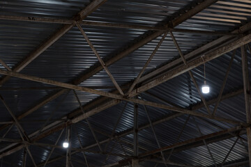 Exploring the unfinished structure of a boiler manufacturing facility with industrial lighting