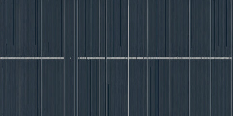 A detailed close up of a solar panel showing the grid lines and the dark blue silicon cells surface